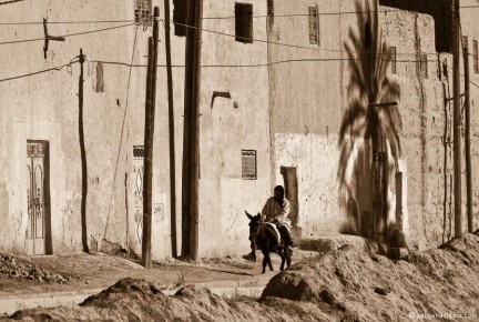 032-080 Man on Donkey in Berber Village BW LRC