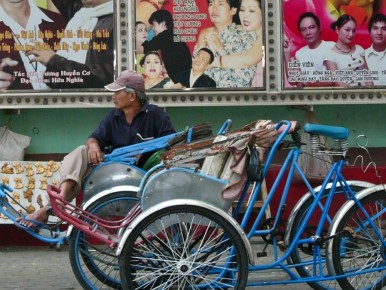 073 022 Saigon movie billboard bicycle rikshaw